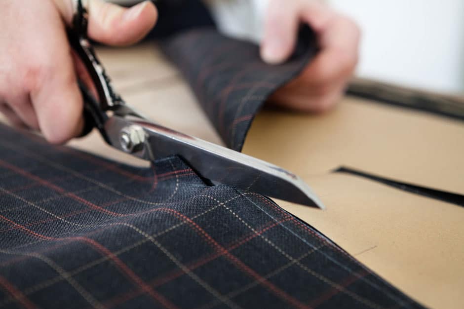 Cutting the cloth to the paper pattern at Egon Brandstetter Bespoke Tailor Berlin