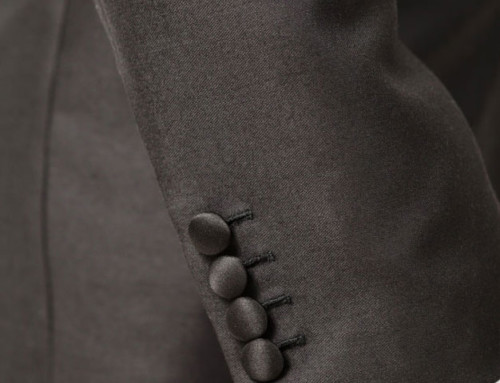 Fabric–covered sleeve buttons of a bespoke dinner jacket