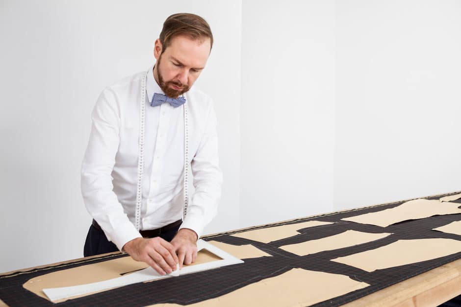 Bespoke tailor Egon Brandstetter constructing the pattern of a bespoke suit